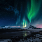 Dramatic Northern Lights over black sand beaches near Reykjavík Iceland 2026