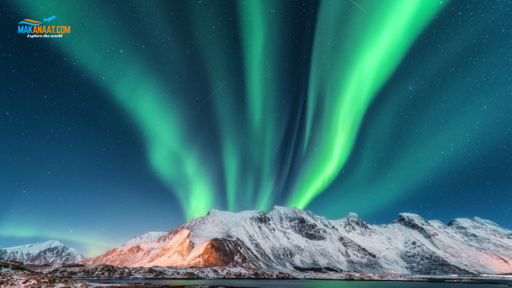 Vibrant green Northern Lights dancing over Tromsø fjords and mountains in Norway during solar maximum 2026